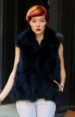  woman wearing black fox fur vest