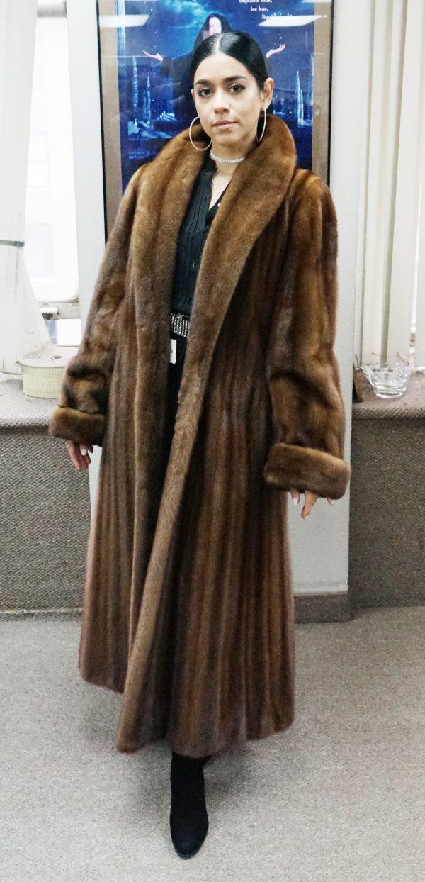 Woman wearing long brown fur coat
