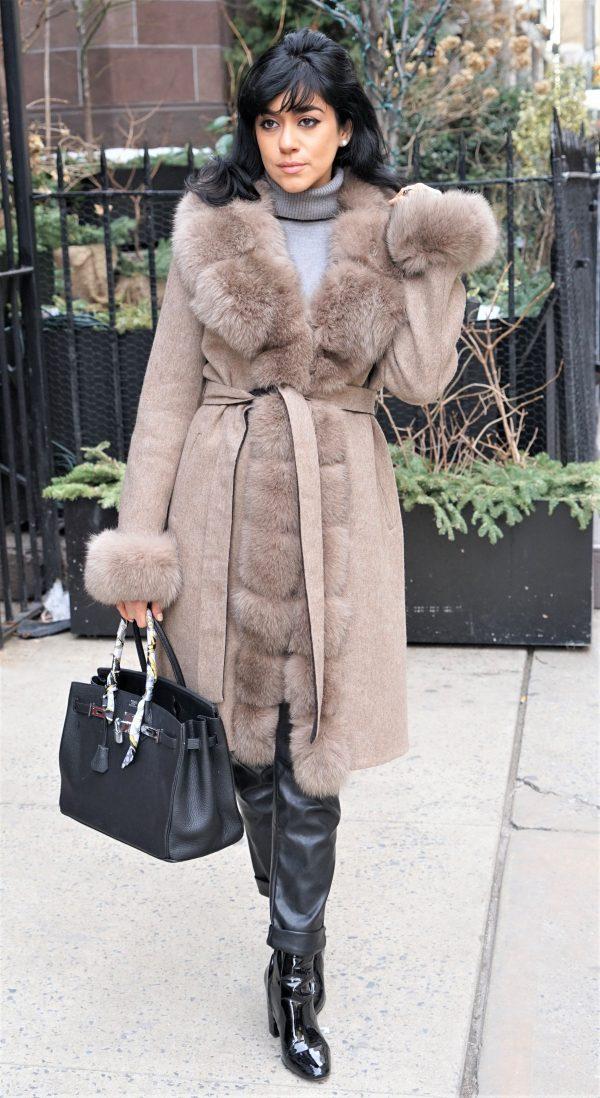 woman wearing knee length fur coat