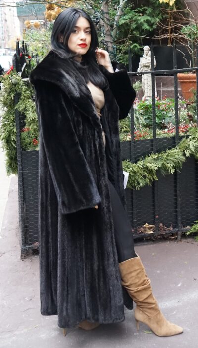 Full length Blackglama mink coat with wide shawl collar and straight sleeves, worn open.
