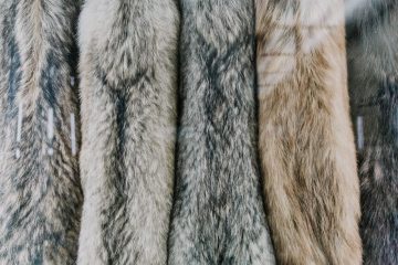 multiple fur jackets hanging