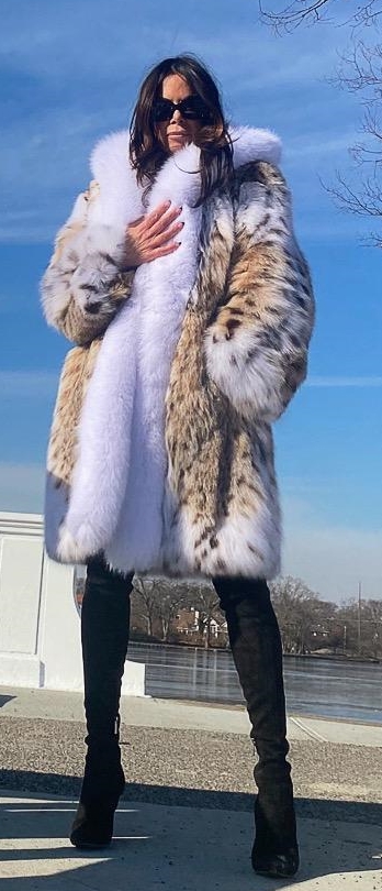 A woman wearing luxurious fur coats