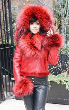 A woman wearing a red luxurious fur coat  