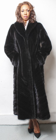woman wearing a black Glama fur coat made from mink fur