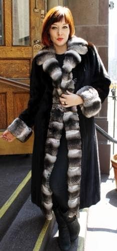 A woman wearing a coat with a mink fur lining