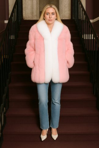 A hip-length pink white fox jacket worn with a wide shawl collar and straight sleeves.